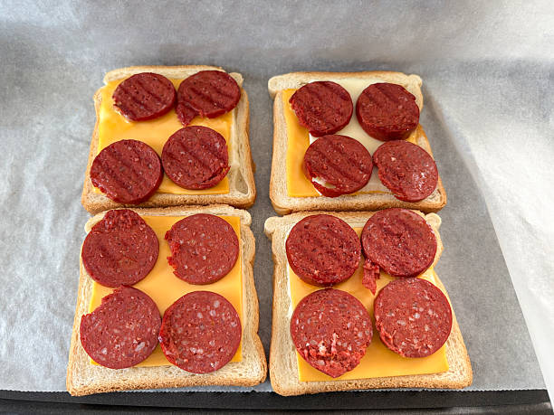 Making toast. Sausage and cheddar cheese toast on the toaster. Turkish food sucuklu tost