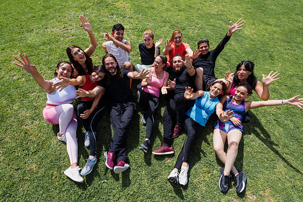 group of handsome multiracial sporty friends smiling looking at camera after exercising
