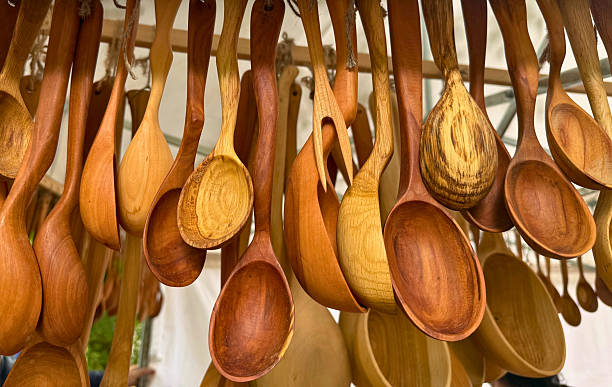 istock Handcrafted wooden spoons hanging on display 2234000696