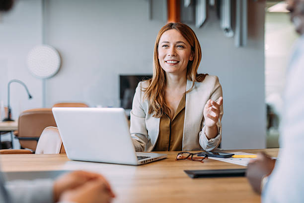 istock Group of business persons talking in the office. 2234001367