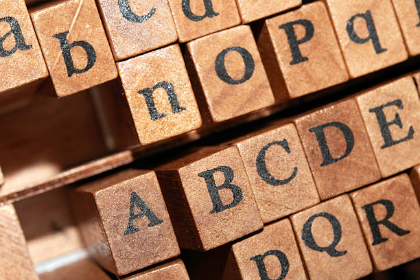 A cluster of colorful educational blocks featuring numbers and mathematical symbols is positioned in the top right and bottom right corners against a bright green background.