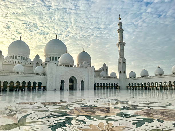 istock Grand Mosque Courtyard in Abu Dhabi – White Domes and Marble Floral Patterns under a Luminous Sky 2234006298