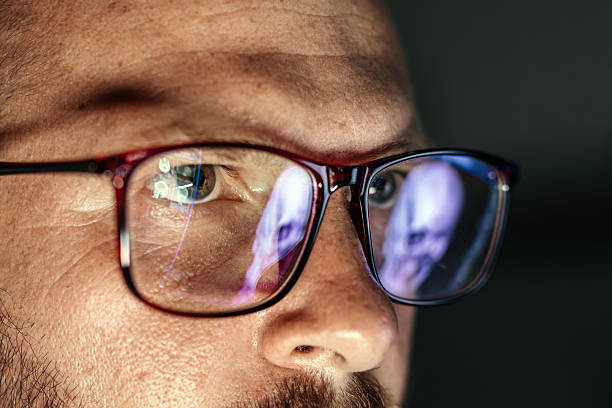 istock Male medical professional with glasses is analyzing computer tomography images on a screen 2234007409