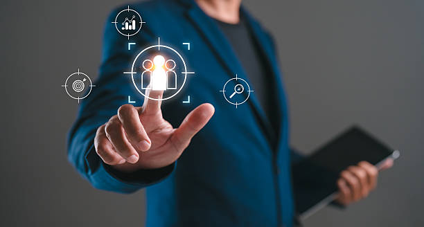 istock A person in a suit interacts with digital icons representing user targeting, showcasing technology in business or marketing strategies. 2234008674
