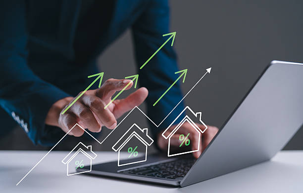 istock A business professional analyzes real estate data on a laptop, with graphics showing upward trends in property values. 2234008708