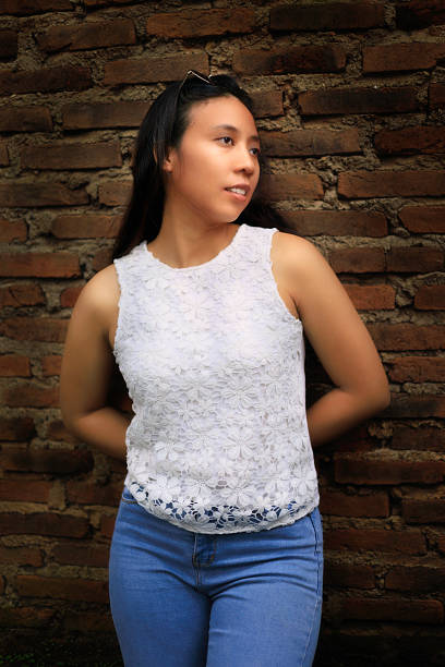 istock Indonesian girl posing in jeans 2234010518