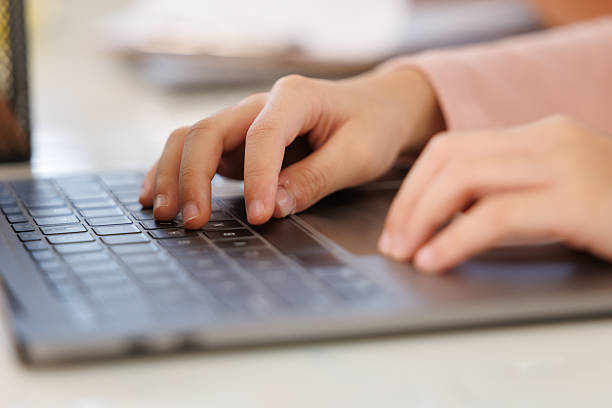 istock Teenagers typing on laptops in the classroom 2234010531