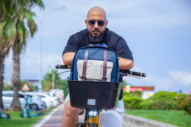 Young tourist renting an e-bike. Young man on vacation renting an E-bike