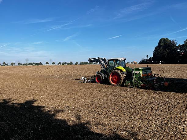 istock Tractor on the freshly picked field 2234012646