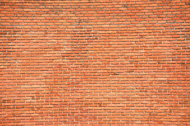 istock facade view of old red brick wall background 2234013279