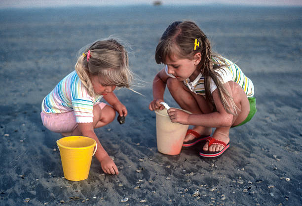 istock Padre Island NS - Sisters Find Seashells - 1984 2234014342