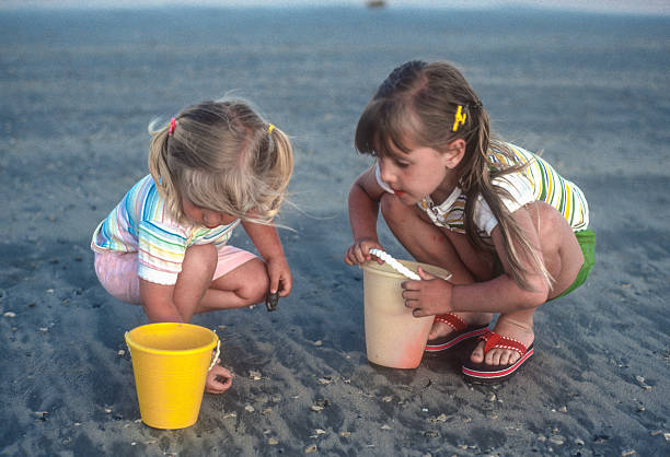 istock Padre Island NS - Sisters Collect Shells - 1984 2234014450