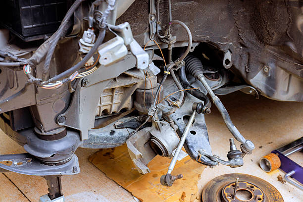 istock Car engine components exposed during repair at garage, showcasing detailed mechanical work tools 2234015435
