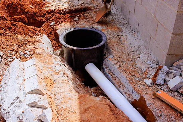 istock Construction site showing trench with drainage pipe installation in progress during works day hours 2234016507