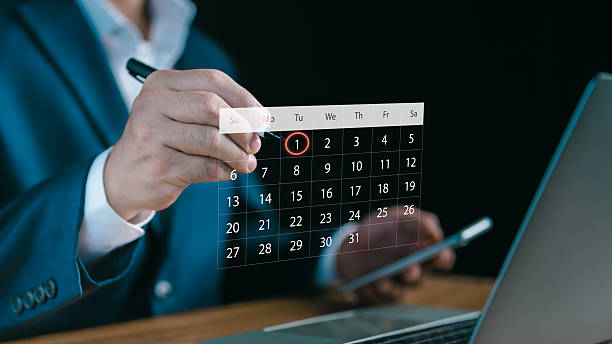 istock A businessman highlights a digital calendar on a virtual screen, symbolizing scheduling, planning, and time management for business tasks, productivity, and efficient project organization. 2234019150
