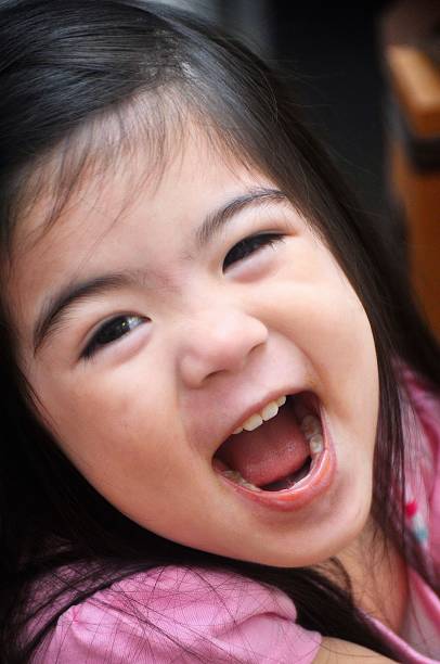 A happy Eurasian child smiling