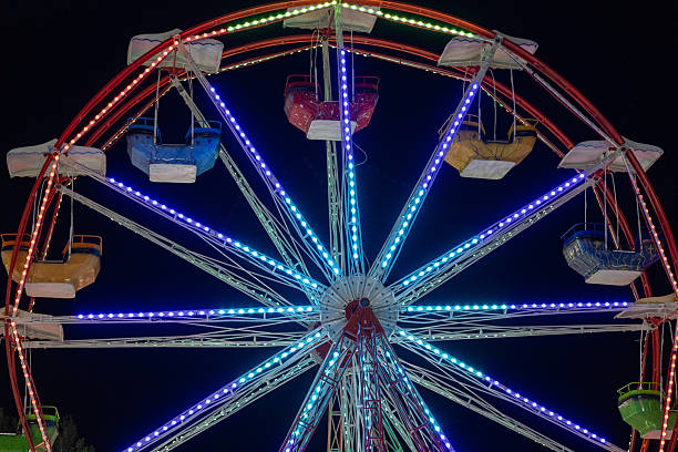 istock Ferris Wheel and Amusement Park Rides at Dusk 2234026112