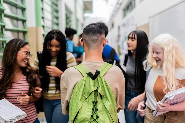 istock Rear view of student walking in school hallway 2234028701