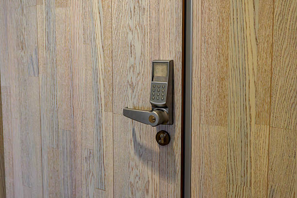 istock Wooden door with electronic keypad lock and handle, front view, modern security system, safety technology, access control solution 2234031763
