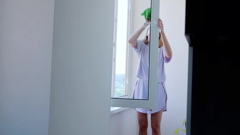 How to find Top-Rated Vacation Rental Cleaning Services in Moorpark, CA 3 Woman organizing bed linens in a cozy, modern bedroom with wooden furniture A woman arranges a stack of pillows and linens on a bed in a softly lit, modern bedroom, showcasing organization and comfort. Rental Cleaning.