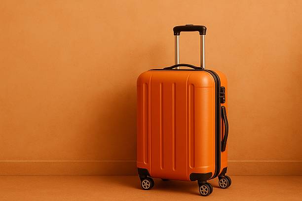 istock orange suitcase in front of the wall 2234037495