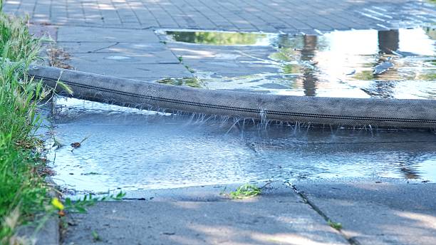 istock Fabric Firehose Leaking Water During Regular Equipment Inspection at Firestation 2234038432