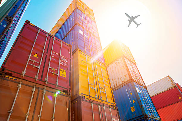 istock Airplane flying above commercial port. 2234040072