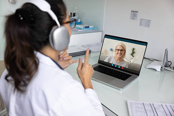 istock Elderly patient displaying on laptop screen during virtual consultation 2234052557