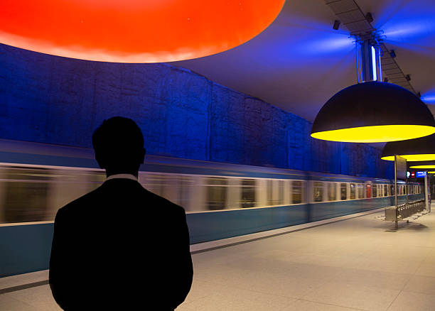 Germany Munich, man waiitng for   subway  Westfriedhof station.