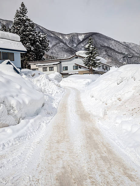 istock Cleared Road Through High Snowdrifts in Nagano 2234061336