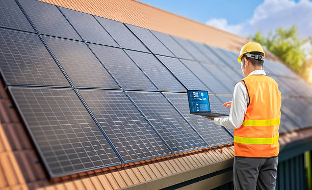 istock Engineer work with solar panels on house roof generate electricity for home use 2234068100