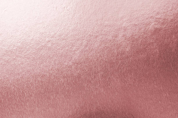 istock Rose gold pink background foil leaf metallic texture wrapping paper for shiny glowing wallpaper design decoration, reflective luminous gradient backdrop 2234068478