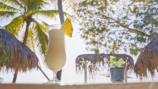 istock Tropical Cocktail With Pineapple Garnish at Martinique Beach 2234073042