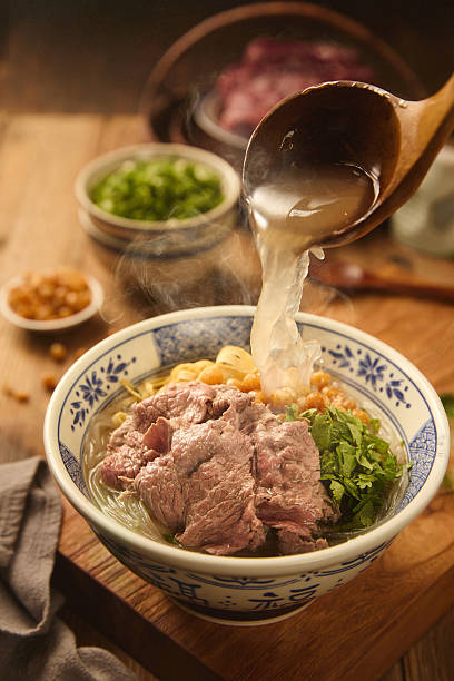 Chef Preparing Traditional Huainan Beef Soup in Restaurant Kitchen(Text translation: Fu is a blessing word, symbolizing good wishes)