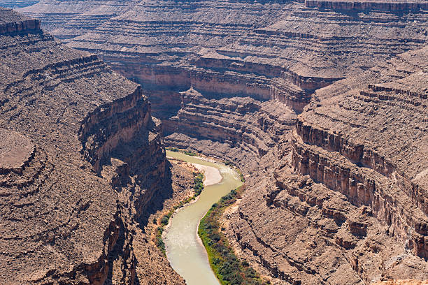 istock Aerial View of a Winding River Through a Deep, Layered Arid Canyon 2234074243