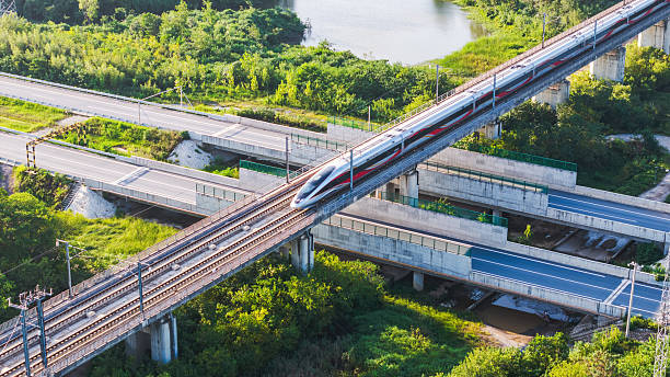 istock High - speed train running on multi - level railway bridge 2234086307