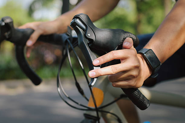 istock Close-up cyclist hand checking bicycle brake lever before morning ride 2234087048