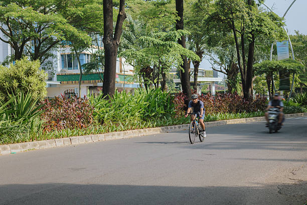 istock Cyclist riding on city road during weekend morning 2234087064