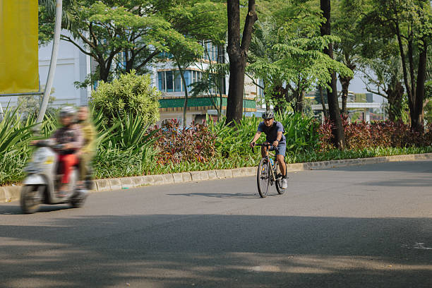istock Cyclist riding on city road during weekend morning 2234087082
