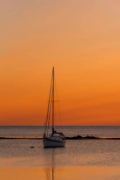 istock Back Harbour, Newfoundland sailboat at sunset 2234090152