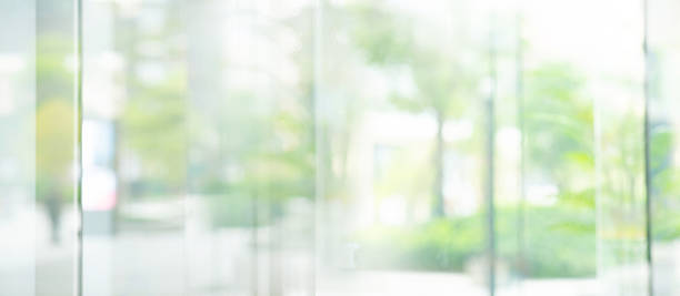 istock Big window glass building with blur green gaeden. 2234093653