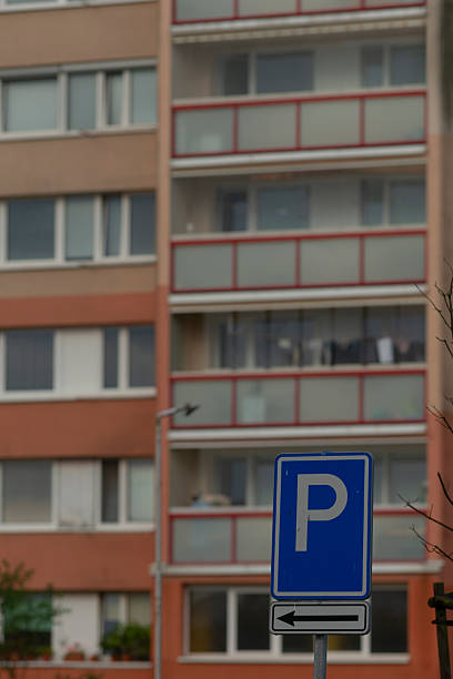 istock Urban Parking Sign with Residential Building Background 2234094021
