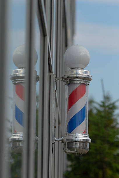 istock A classic Barbershop Pole beautifully reflected in a warm window 2234094050