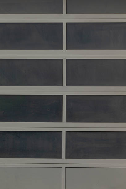 istock This is a modern garage door design featuring beautiful glass panels 2234096781