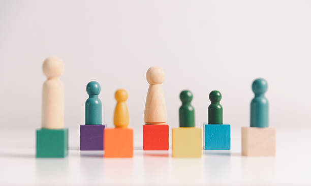 Concept of diversity, inclusion, equality is highlighted in team setup, wooden elements, symbolizing leadership, authority, influence, strong communication skills, inclusive organizational structure.