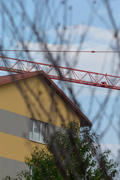 istock A vibrant urban construction scene showcasing a towering crane and building 2234098574