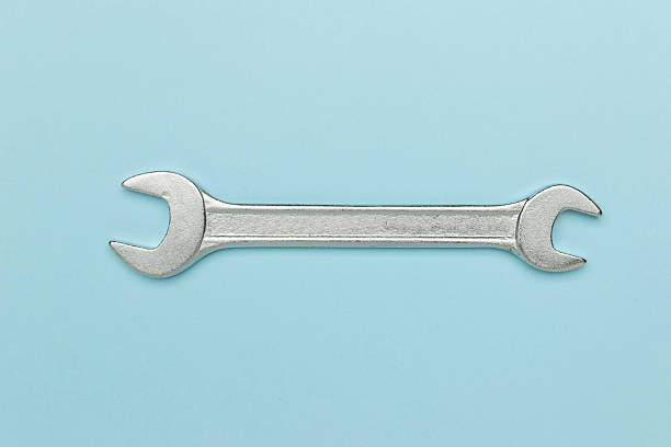 istock Silver Open-End Wrench on Light Blue Background - Minimalist Industrial Tool Still Life 2234099319