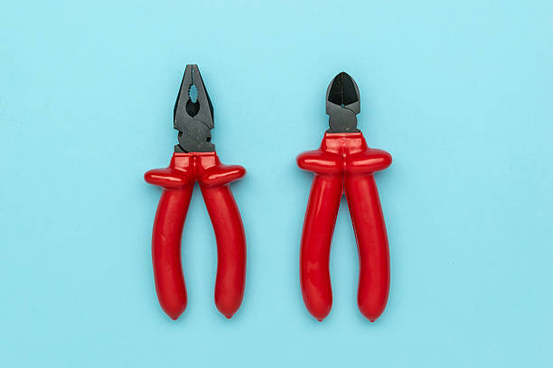 istock Red Hand Tools on Blue Background: Pliers and Wire Cutters for DIY Projects and Repairs 2234099327