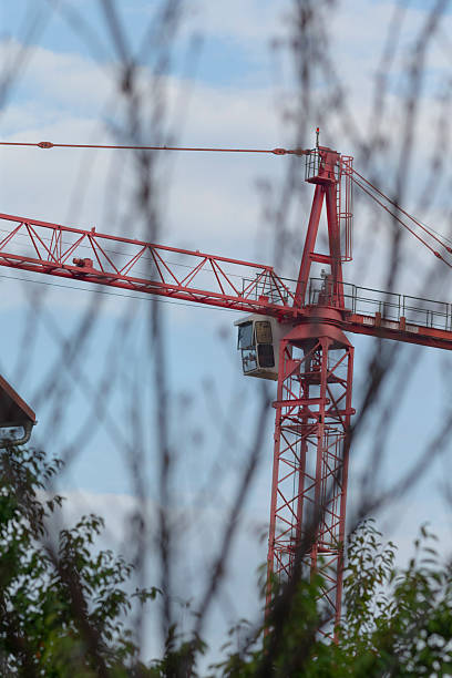 istock A Tall Urban Construction Crane Stands Out Against a Cloudy Sky 2234100953