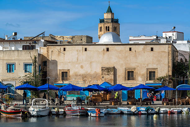 The Old Port of Bizerte is a port with its small pool surrounded by white houses, cafes and large boats in bright colors. It is the most charming place in Bizerte. Bizerte is a city located in northwest of Tunisia. It is the northernmost city in Africa.